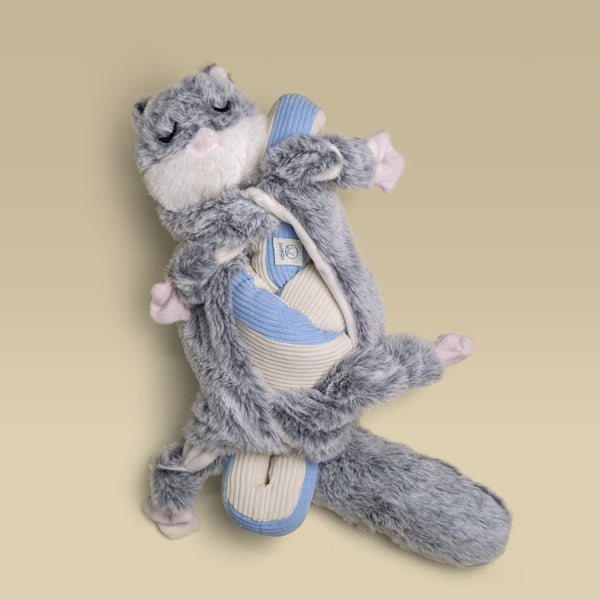 Flying squirrel Hugaboo snuffle toy wrapped around a blue Udon snuffle toy.